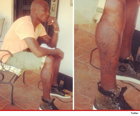 Chad Johnson works out on “Hard Knocks,” Tattoo’s Evelyn Lozada’s face on his leg [photo]
