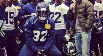 The Assist: Seattle Seahawks flick up with Drake at practice [photos]